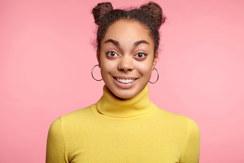 Excited smiling young woman